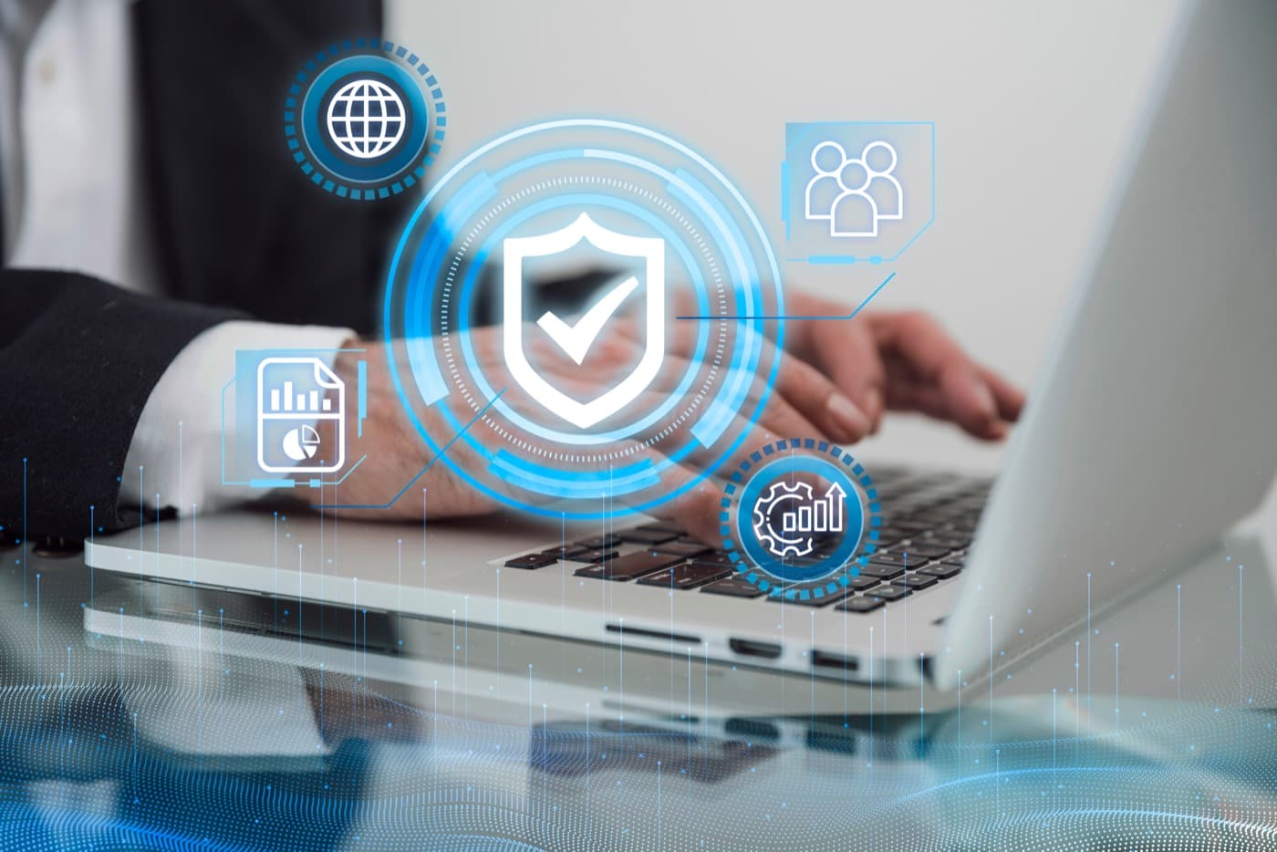 Security shield and permission icons overlaid on a laptop keyboard