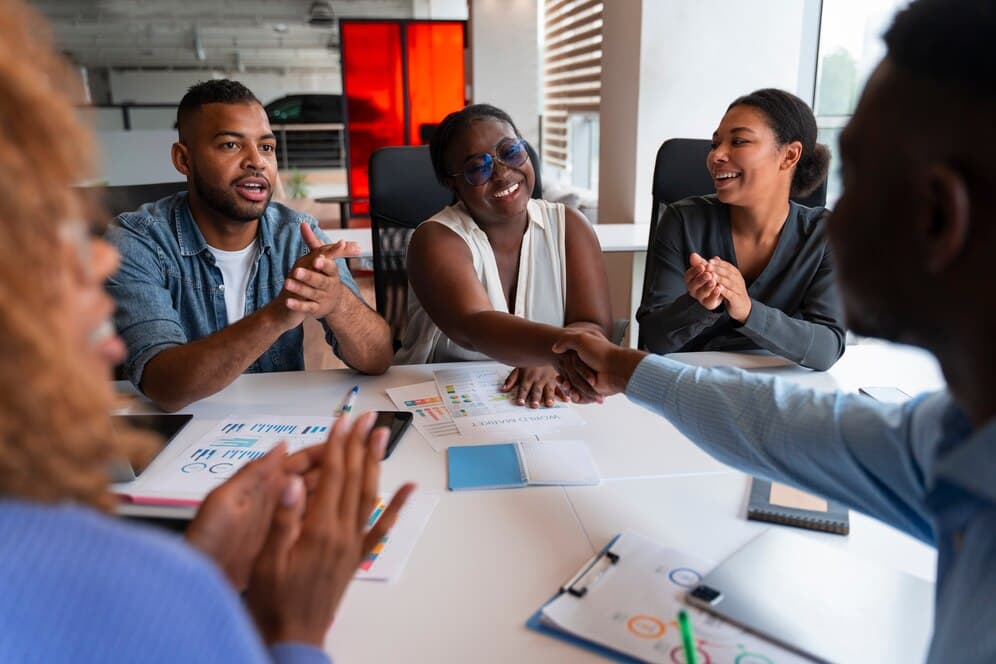 A group of people working together - 6 Strategies You Need for Collaboration and Task Management - BizEdge blog