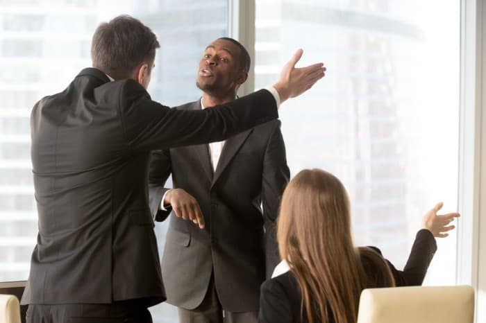 annoyed team members arguing - employee misconduct - BizEdge blog