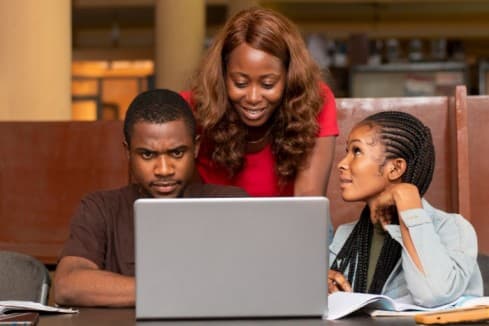 a group of people working together - on-the-job-training - BIzEdge blog