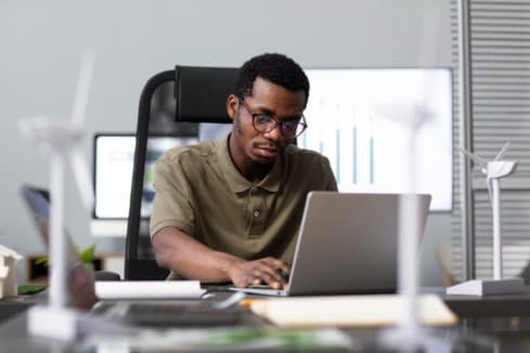 a man on his laptop - performance management software - BizEdge blog