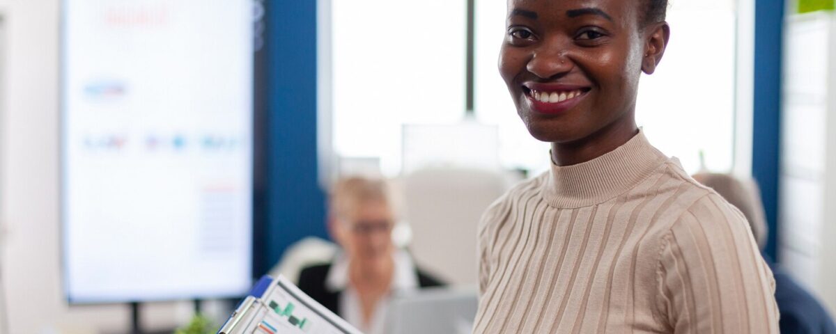 A smiling employee. Implementing a 360 feedback in your organisation performance review. Best way to review your employees performance.