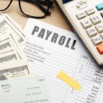 A picture of a paper with payroll written on it - BizEdge blog - The Impact of Payroll Mistakes on Your Business