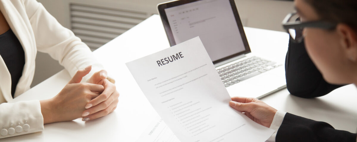 A company representative reading an applicant resume- reference check - BizEdge blog