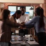 A picture of people collaborating together - Employee Engagement -BizEdge post