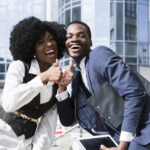 Two happy employees-How to Create Fair and Efficient Shift Schedules for Your Team - BizEdge blog