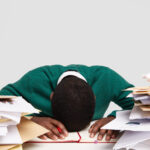 A picture of a stressed employee - How to Avoid Last Minute Call-Offs - BizEdge blog
