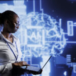 A picture of a lady using her system - The Role of AI in Modern HR: What Businesses Need to Know - BizEdge blog