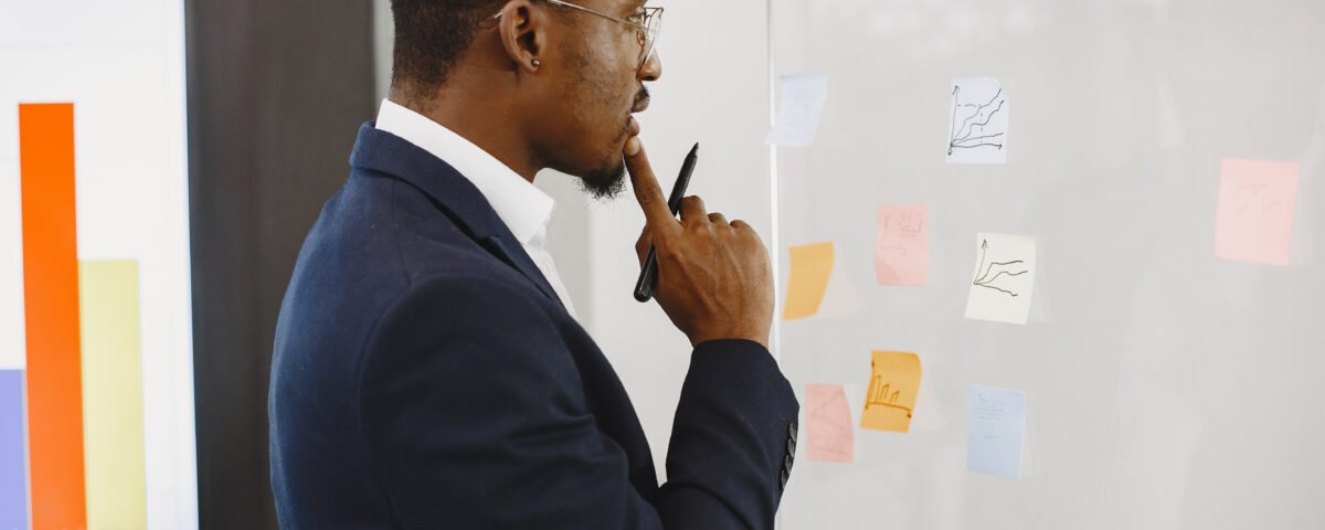 A picture of a man strategizing - Why Your Retention Strategy Needs a Mid-Level Focus - BizEdge Blog