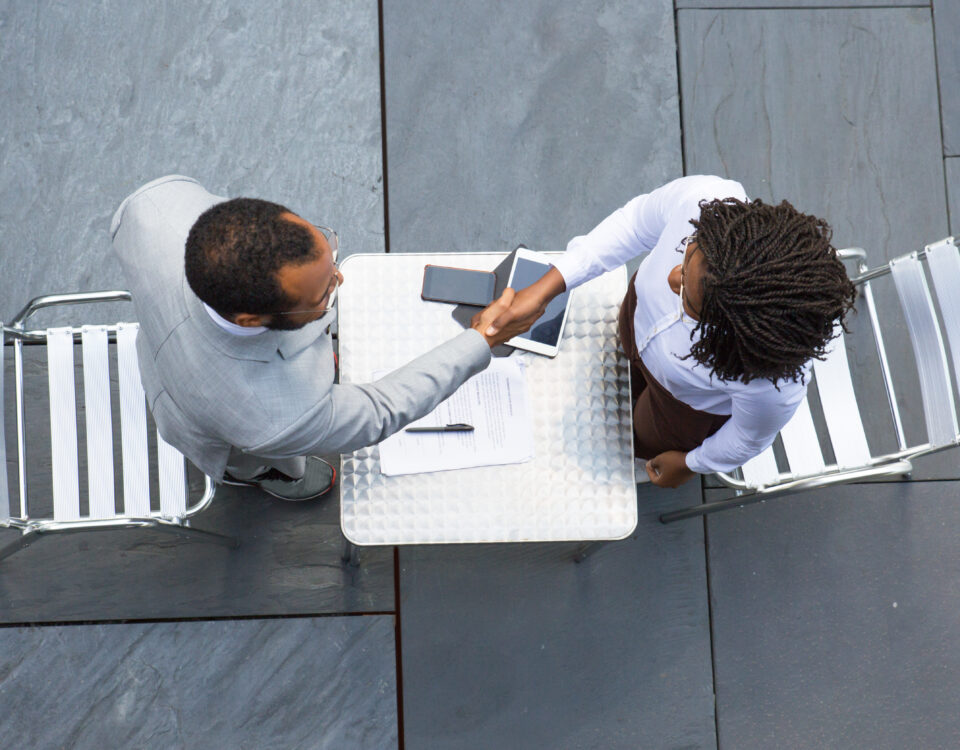 A picture of two people discussing - Why You Need to Conduct an Exit Interview - Bizedge Blog
