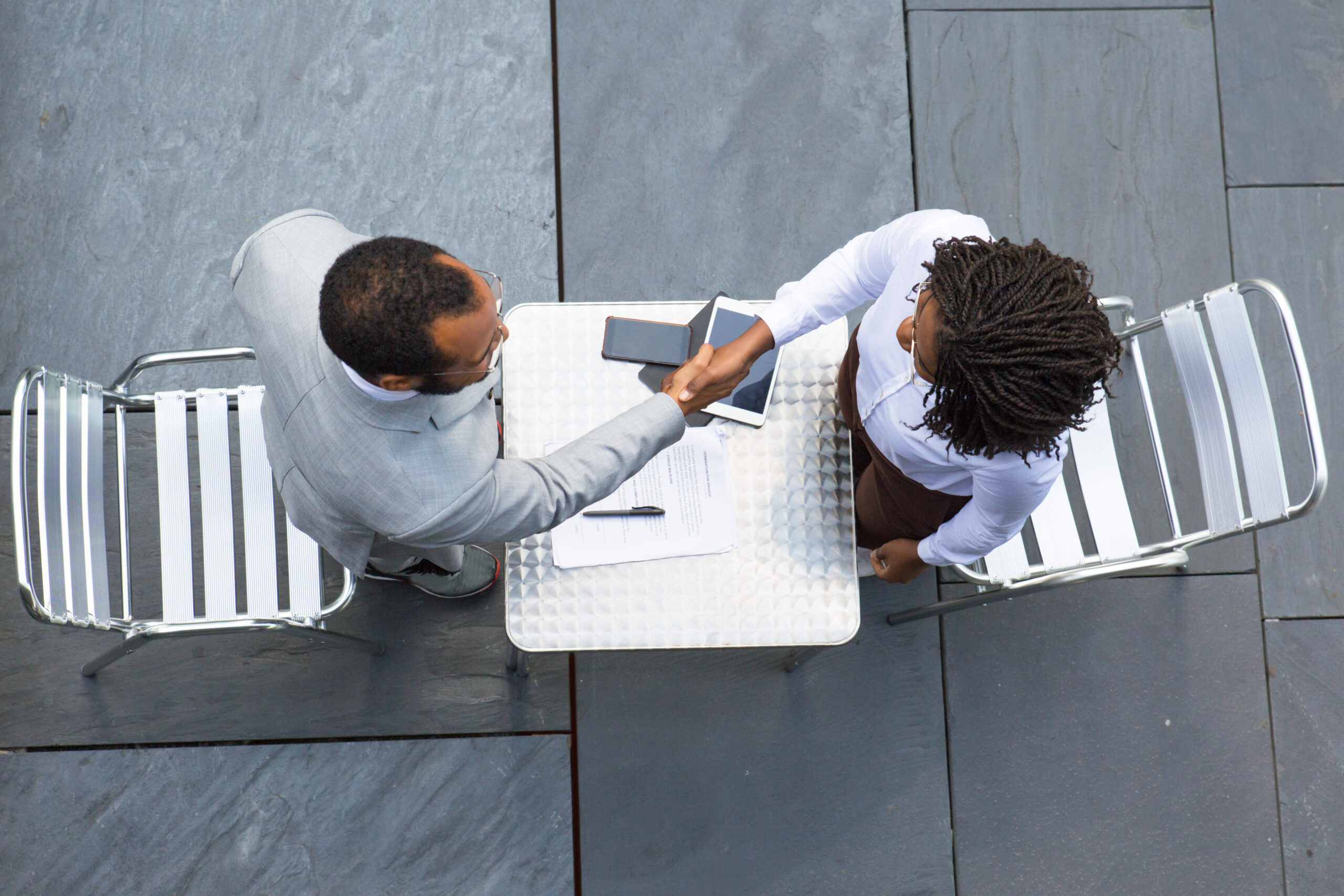 A picture of two people discussing - Why You Need to Conduct an Exit Interview - Bizedge Blog