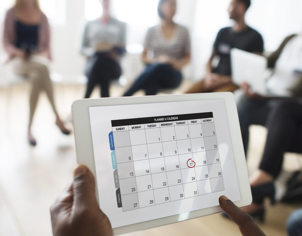 A picture of a calendar on someone's hand - Why Employee Time Tracking is Important - BizEdge blog
