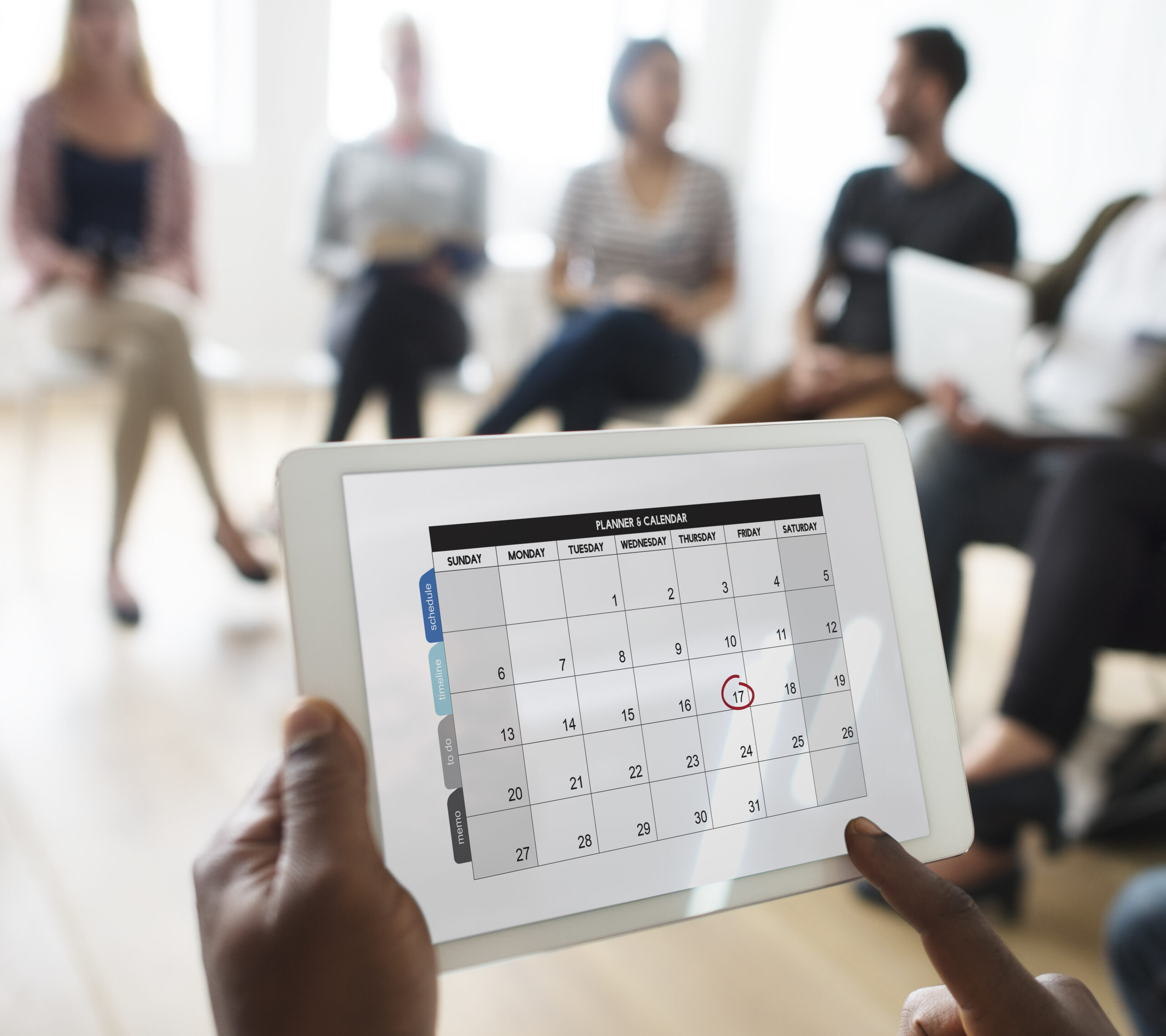 A picture of a calendar on someone's hand - Why Employee Time Tracking is Important - BizEdge blog
