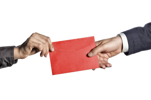 two men exchanging an envelope - 5 Expert Ways to Retain Top Talent - BizEdge blog