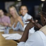 a picture of a group of people in a meetings - Reasons Why Town Halls Meetings Are Important - BizEdge blog