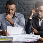 A picture of two people looking serious - BizEdge blog