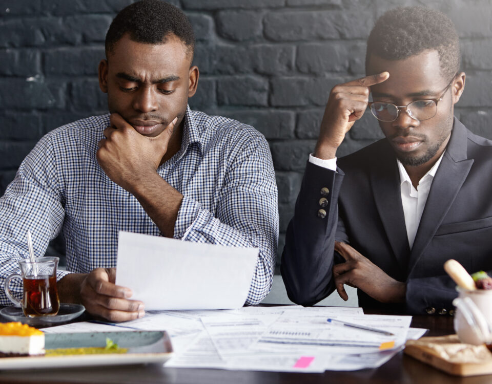 A picture of two people looking serious - BizEdge blog