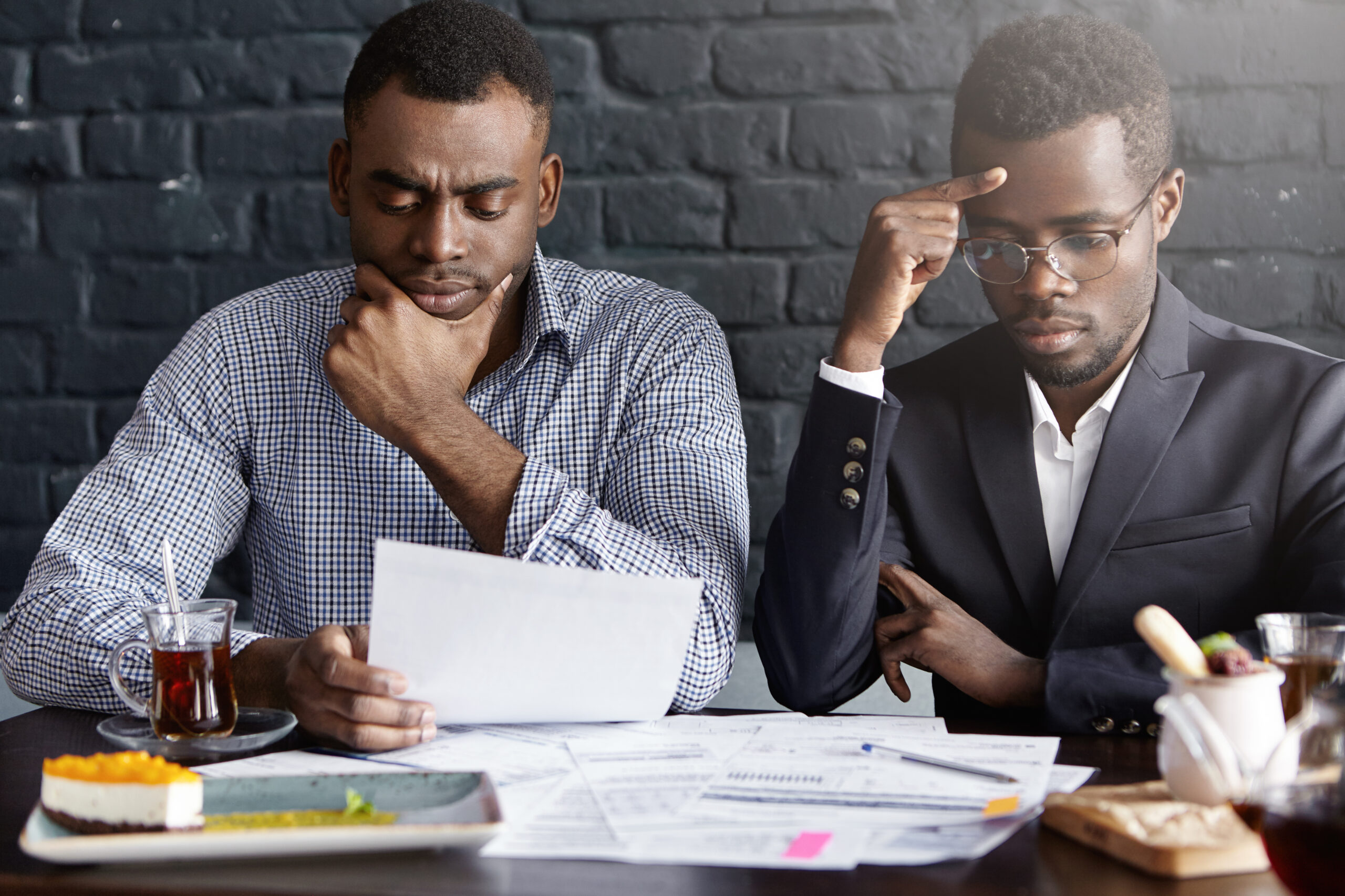 A picture of two people looking serious - BizEdge blog