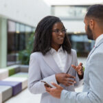 a man and a woman in a conversation - 5 important reasons employees reject internal promotions - BizEdge blog
