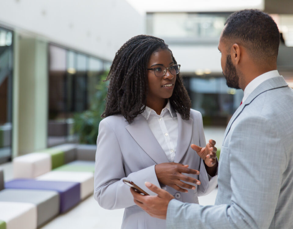 a man and a woman in a conversation - 5 important reasons employees reject internal promotions - BizEdge blog