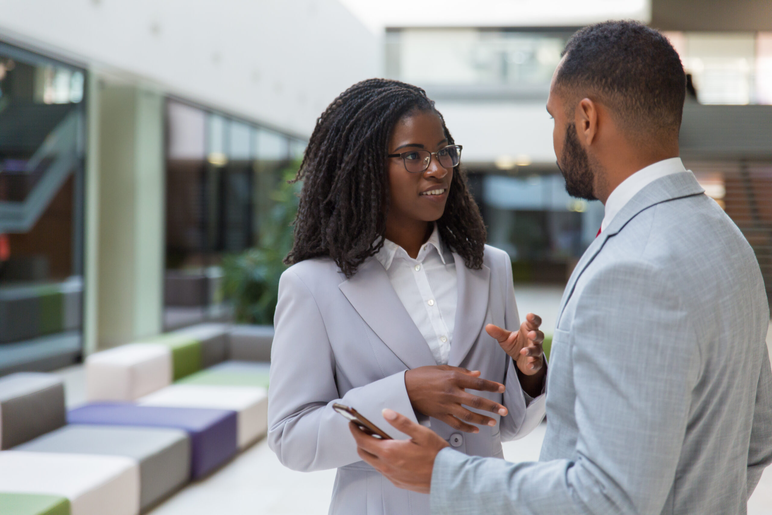 a man and a woman in a conversation - 5 important reasons employees reject internal promotions - BizEdge blog