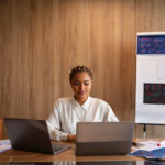 a woman working on her system - performance goals - BizEdge blog