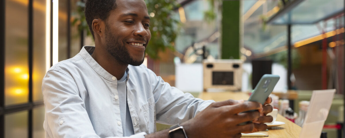 a man using his phone - employee self-service software - BizEdge blog