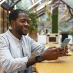 a man using his phone - employee self-service software - BizEdge blog