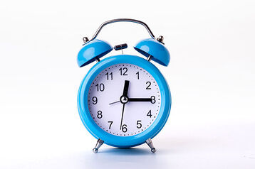 an alarm clock- best attendance software for businesses - BizEdge blog