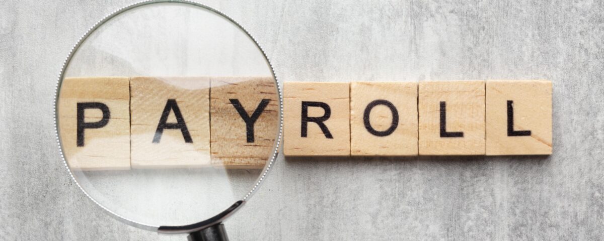 payroll concept with wooden cubes - payroll software - BizEdge blog