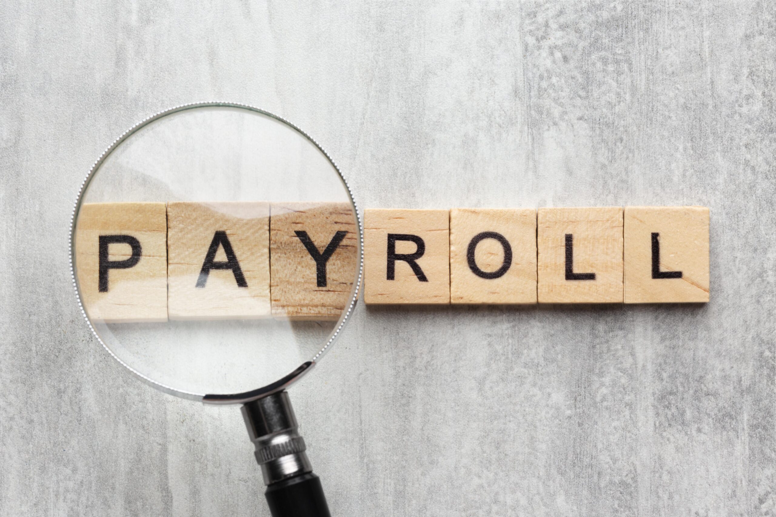 payroll concept with wooden cubes - payroll software - BizEdge blog