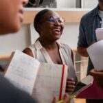 Staff members and leader analyzing a report - employee engagement tips - BizEdge blog