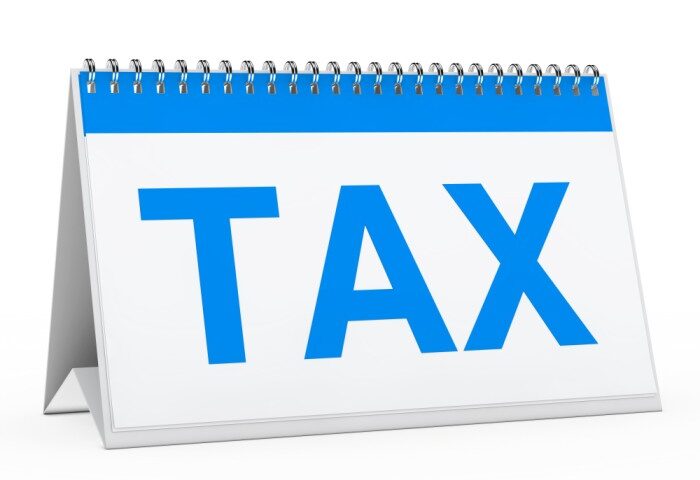 A calendar that has the word tax written on it - New PAYE Tax Law in Nigeria - BizEge blog