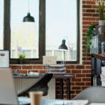 company employee standing in his office space while using his tablet - BizEdge v2 - BizEdge blog