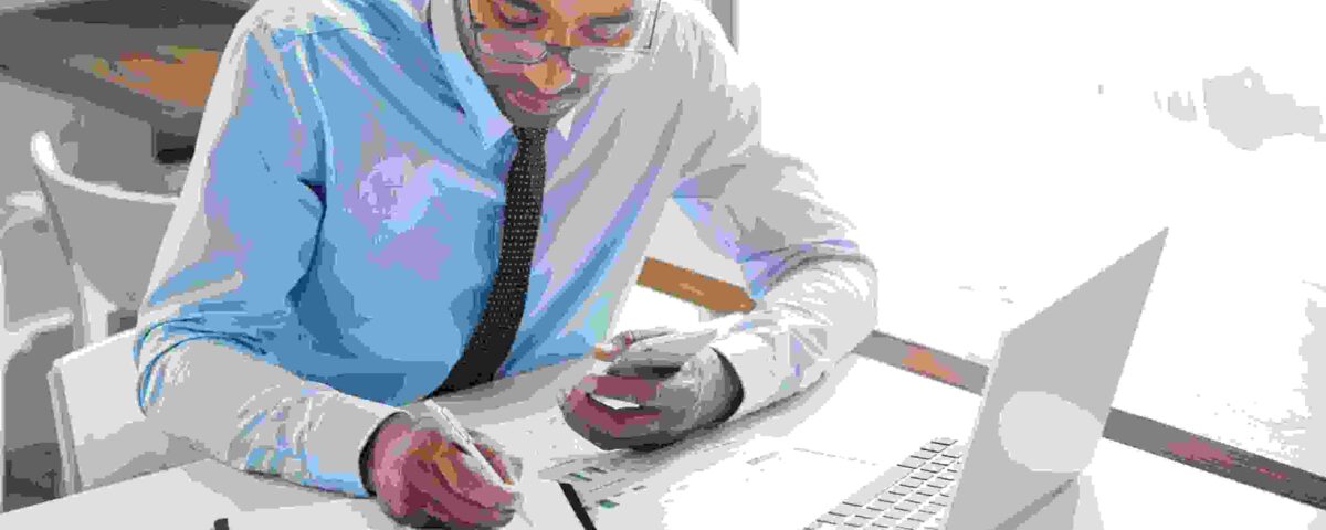 a man working on his laptop - Payroll Automation - BizEdge blog