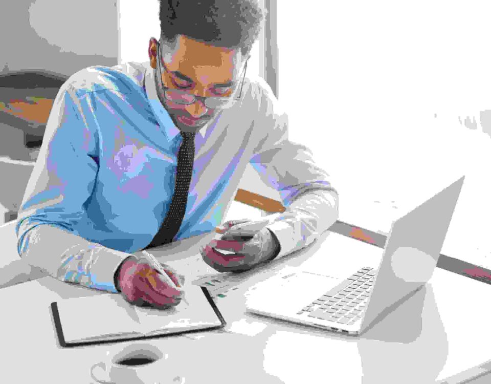 a man working on his laptop - Payroll Automation - BizEdge blog