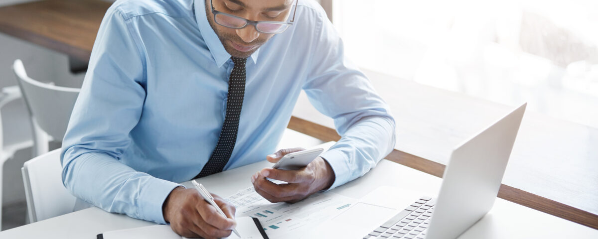 a man working on his laptop - Payroll Automation - BizEdge blog