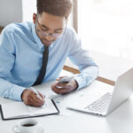 a man working on his laptop - Payroll Automation - BizEdge blog