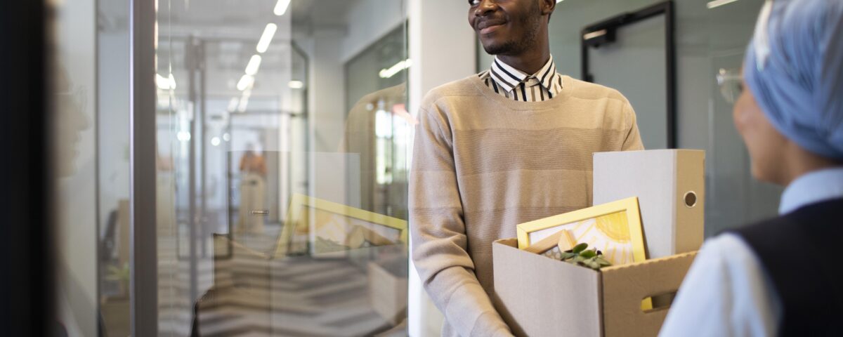 a man holding different document in a carton -employee turnover - BizEdge blog