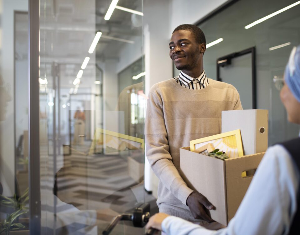 a man holding different document in a carton -employee turnover - BizEdge blog