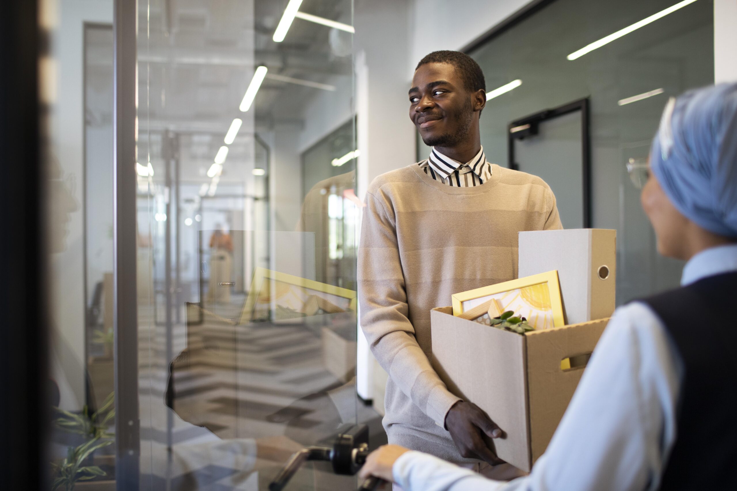 a man holding different document in a carton -employee turnover - BizEdge blog