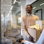 a man holding different document in a carton -employee turnover - BizEdge blog