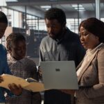 Staff members and leader analyzing a report - employee engagement tips - BizEdge blog