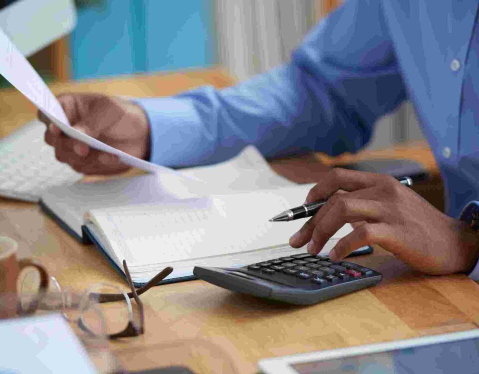 Close-up image of a man working on reports - new tax law - BizEdge blog