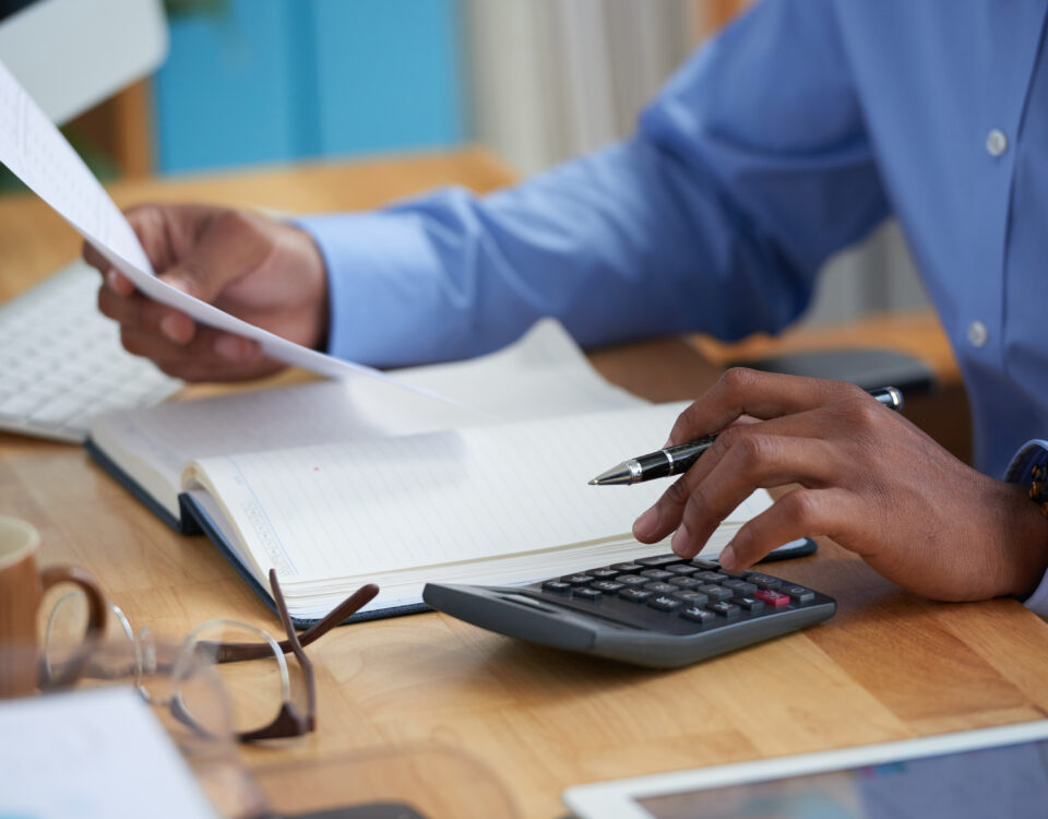 Close-up image of a man working on reports - new tax law - BizEdge blog