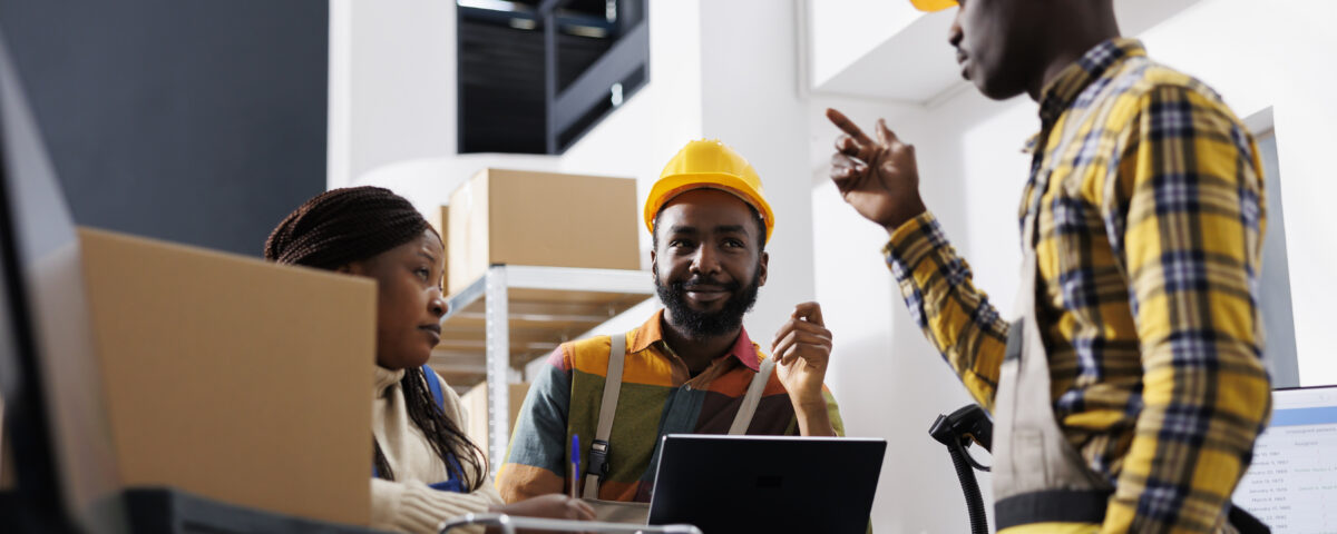 Logistics managers discussing goods distribution at work - accountability in the workplace - BizEdge blog