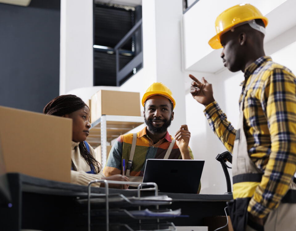 Logistics managers discussing goods distribution at work - accountability in the workplace - BizEdge blog