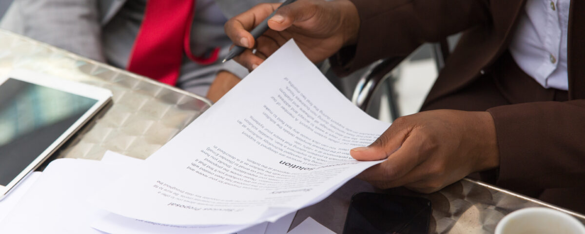 business man assessing records - employer of record - BizEdge blog