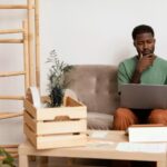 a man working at home - employee benefits - BizEdge blog