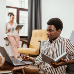a man working at home - employee benefits - BizEdge blog